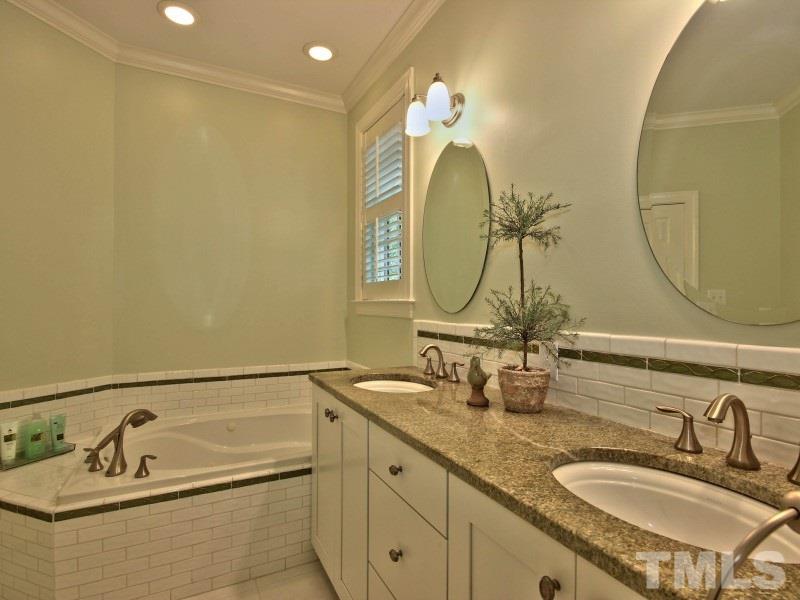 164 Yorkchester Way, Unit 13 Raleigh, NC 27615 - Photo 14 of 23 a bathroom with a double vanity sink and a mirror