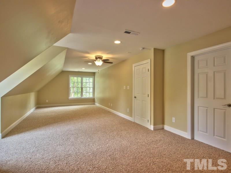 164 Yorkchester Way, Unit 13 Raleigh, NC 27615 - Photo 17 of 23 a view of a big room with windows and chandelier fan