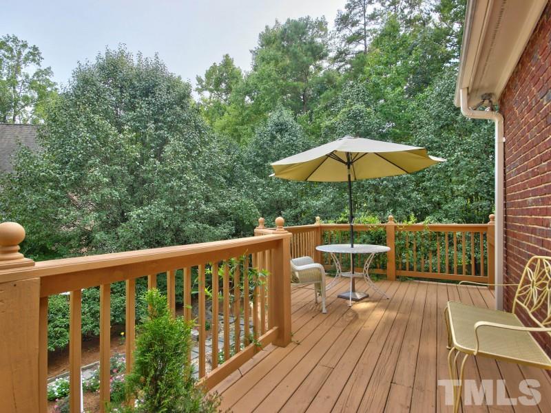 164 Yorkchester Way, Unit 13 Raleigh, NC 27615 - Photo 20 of 23 a view of balcony with wooden floor and outdoor seating