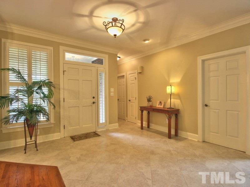 164 Yorkchester Way, Unit 13 Raleigh, NC 27615 - Photo 3 of 23 a view of a livingroom with furniture and a potted plant