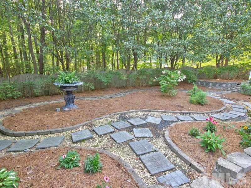 164 Yorkchester Way, Unit 13 Raleigh, NC 27615 - Photo 23 of 23 a view of a park with large trees