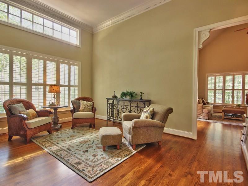 164 Yorkchester Way, Unit 13 Raleigh, NC 27615 - Photo 5 of 23 a living room with furniture and a wooden floor