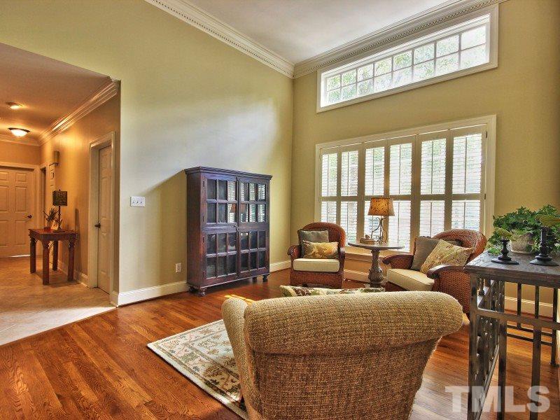 164 Yorkchester Way, Unit 13 Raleigh, NC 27615 - Photo 6 of 23 a living room with furniture and a table