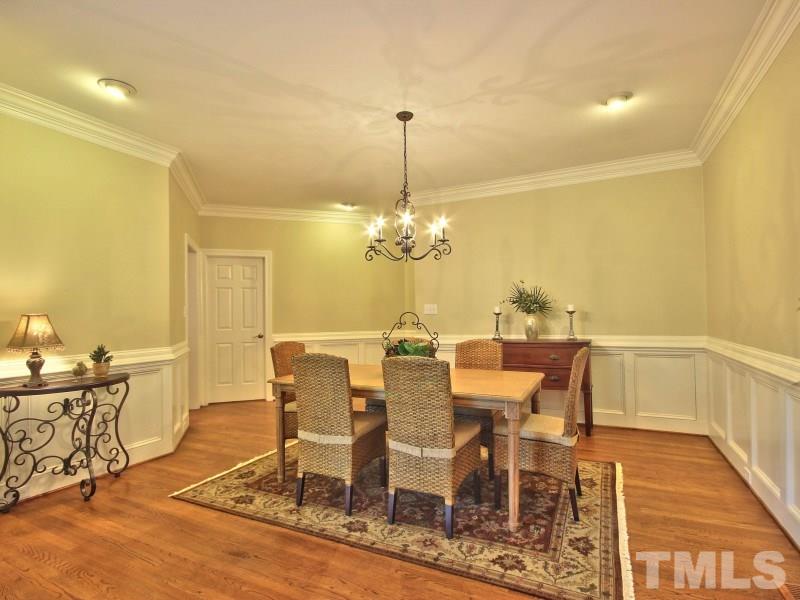 164 Yorkchester Way, Unit 13 Raleigh, NC 27615 - Photo 7 of 23 a view of a dining room with furniture and chandelier