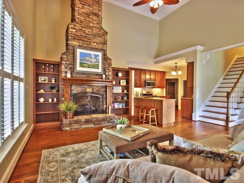 164 Yorkchester Way, Unit 13 Raleigh, NC 27615 - Photo 9 of 23 a living room with furniture and a fireplace