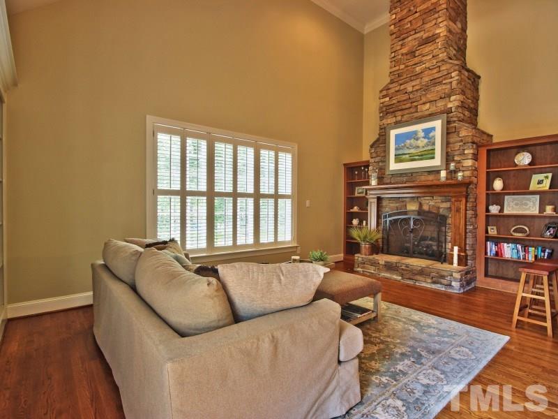 164 Yorkchester Way, Unit 13 Raleigh, NC 27615 - Photo 10 of 23 a living room with furniture and a fireplace