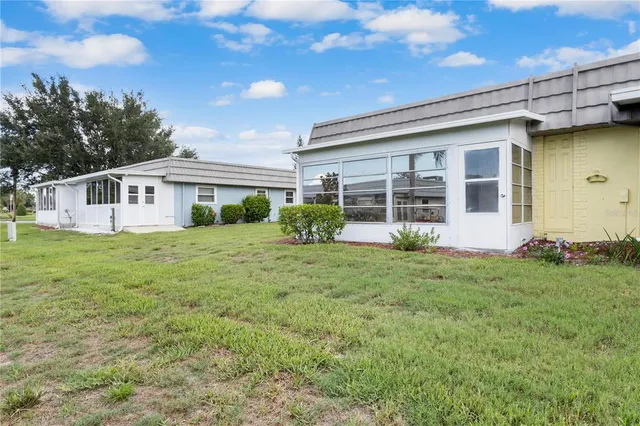 a view of a house with backyard
