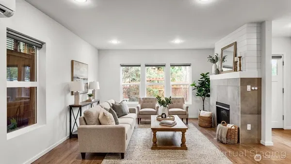 a living room with furniture and a fireplace