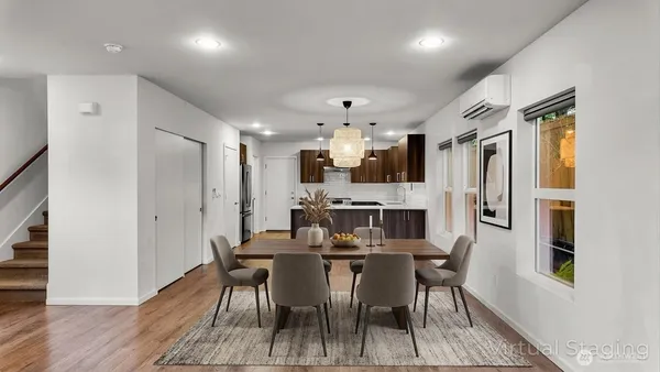 a view of a dining room with furniture and wooden floor