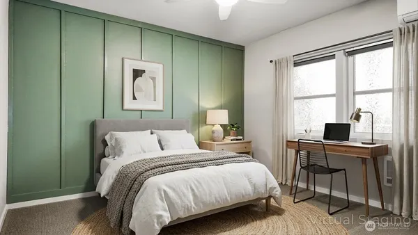 a bedroom with a bed and a window
