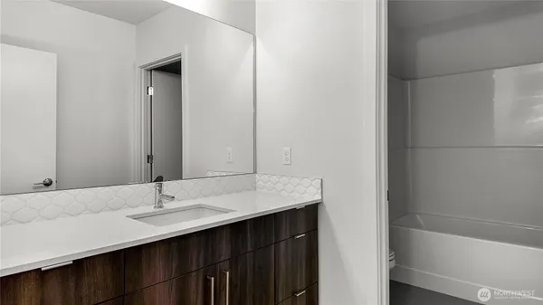a bathroom with a sink and a bathtub