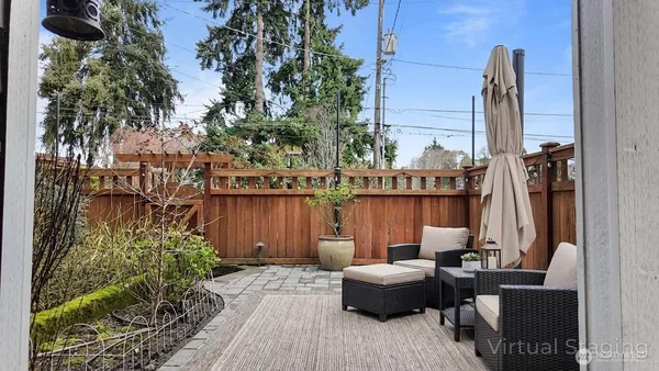a view of balcony with couch and potted plants