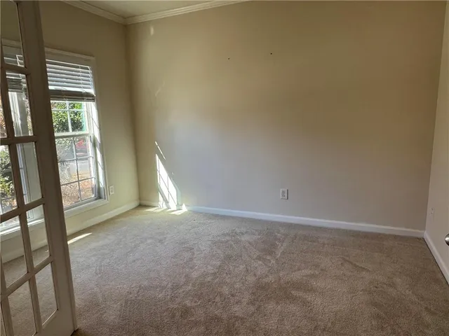 a view of an empty room and window