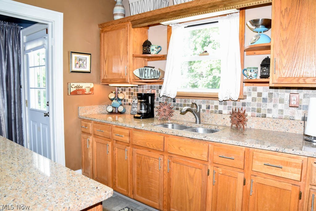 2518 Lake Rd Boulevard Northwest Canton, OH 44708 - Photo 5 of 17 Kitchen has a pantry and spice cabinets.