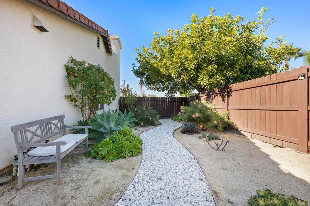 5331 Mead Street Oceanside, CA 92056 - Photo 25 of 29 a view of a backyard with chair and potted plants