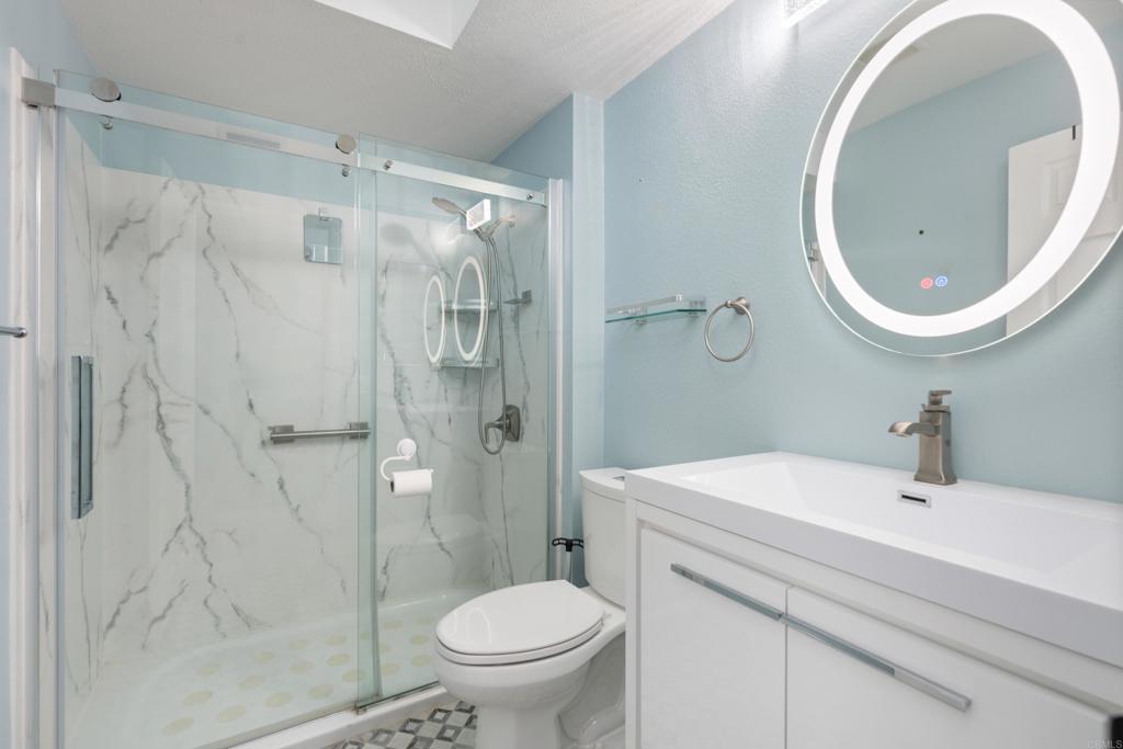 5331 Mead Street Oceanside, CA 92056 - Photo 10 of 29 a bathroom with a sink toilet and shower