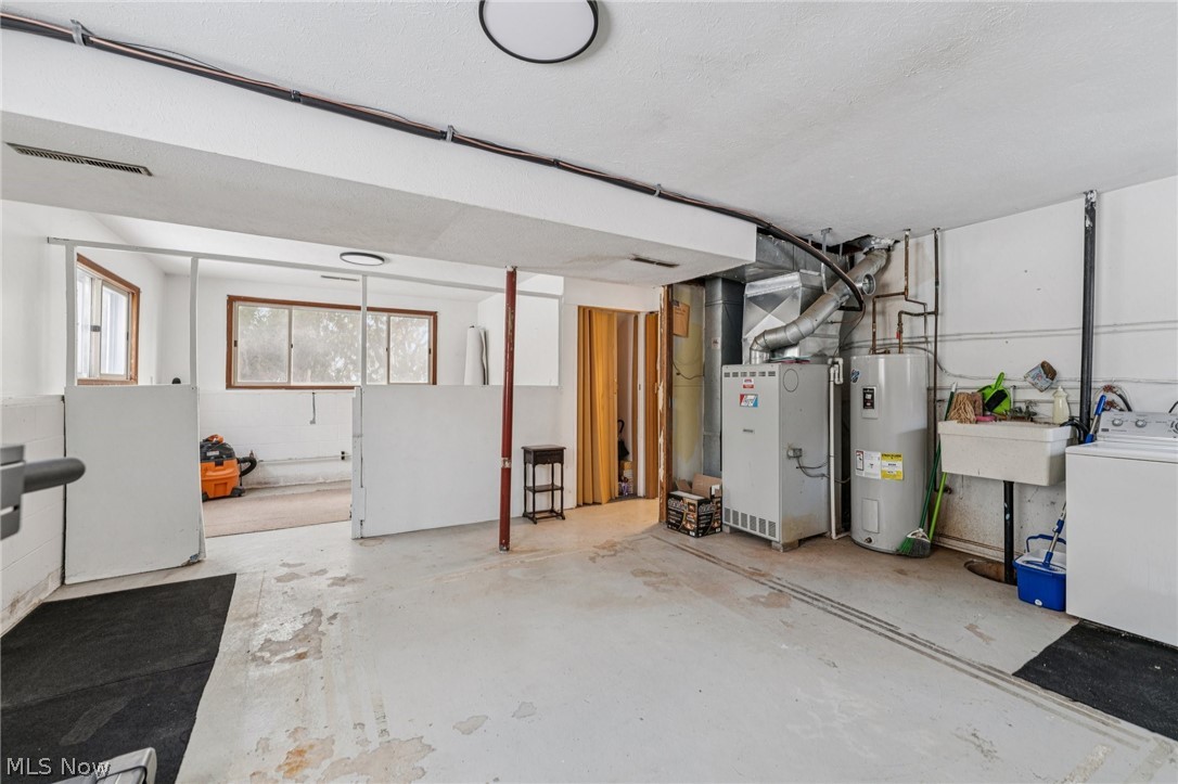 15615 Mason Road Vermilion, OH 44089 - Photo 21 of 34 Basement featuring washer / dryer, water heater, and heating unit
