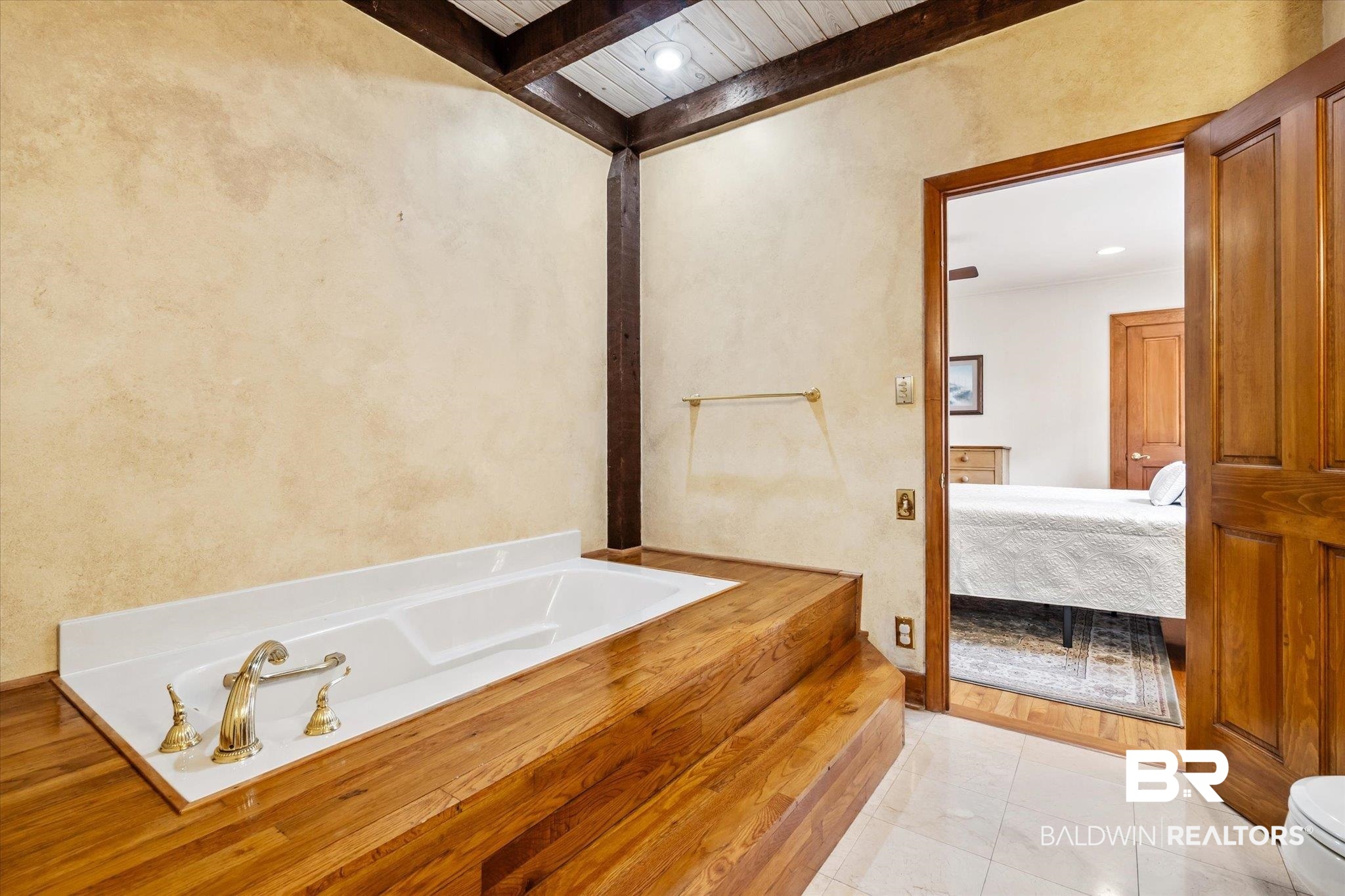 2228 Riverside Drive Mobile, AL 36605 - Photo 26 of 51 Bathroom with toilet, beamed ceiling, tile patterned flooring, a tub to relax in, and wood ceiling
