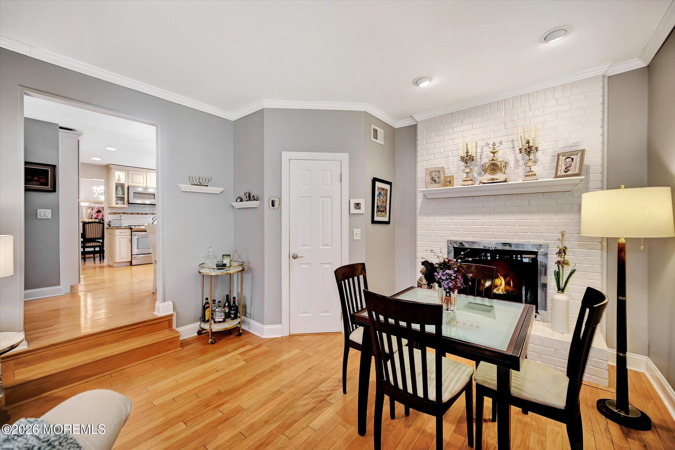 18 Devon Drive Manalapan, NJ 07726 - Photo 18 of 40 19-Family Room - Fireplace Area to Kitch