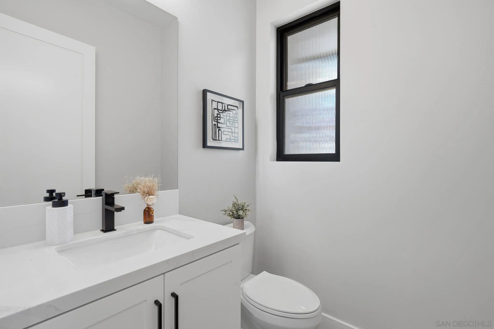 3916 Citrus Drive Fallbrook, CA 92028 - Photo 40 of 72 a bathroom with a sink a toilet and mirror