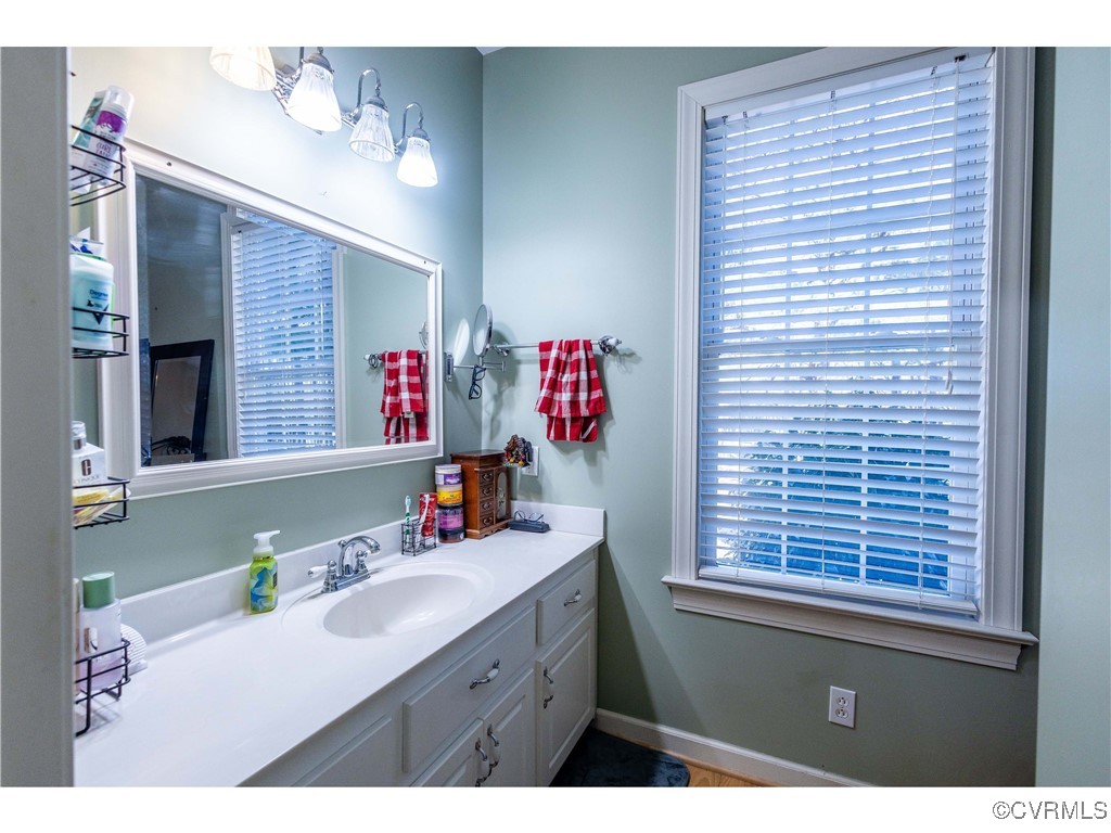 1047 Camera Road Waverly, VA 23890 - Photo 12 of 48 a bathroom with a sink vanity and a mirror