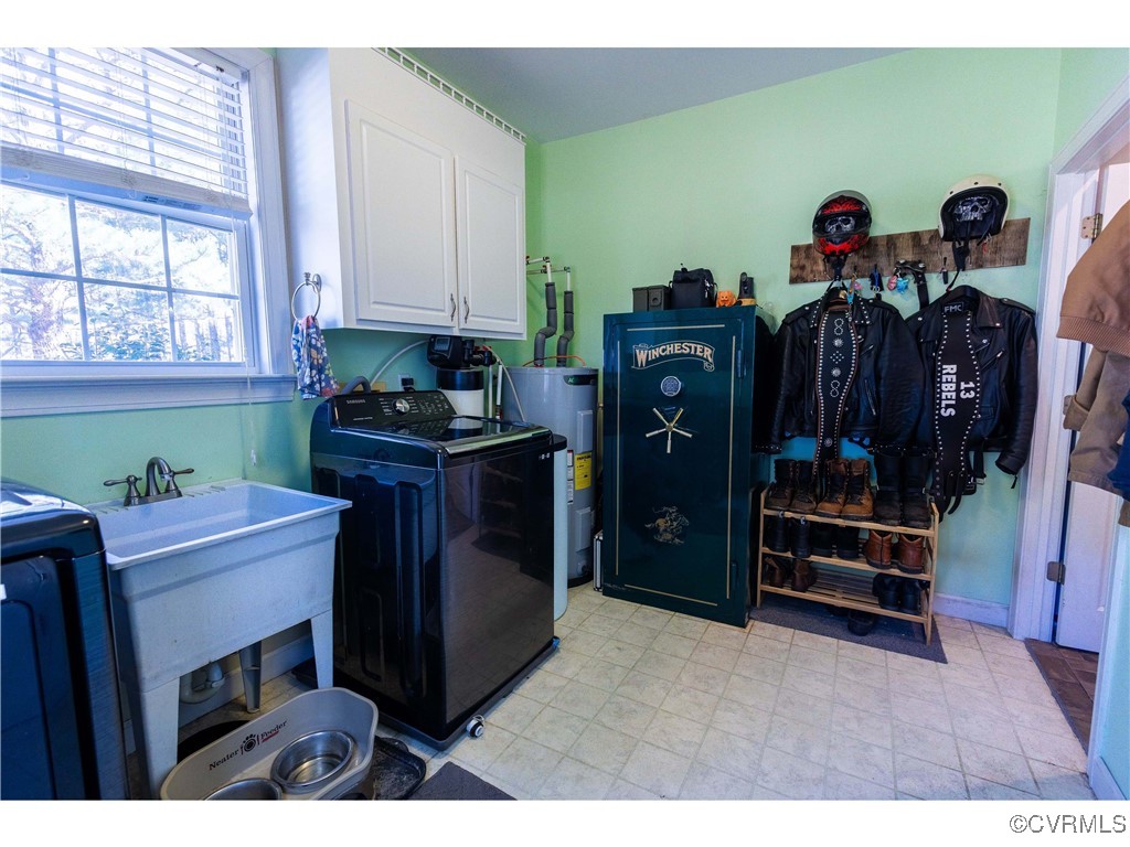 1047 Camera Road Waverly, VA 23890 - Photo 18 of 48 a view of a kitchen with fridge and workspace