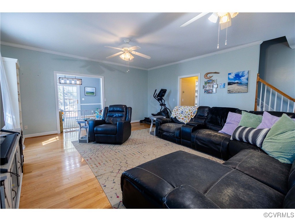 1047 Camera Road Waverly, VA 23890 - Photo 19 of 48 a living room with furniture and a flat screen tv