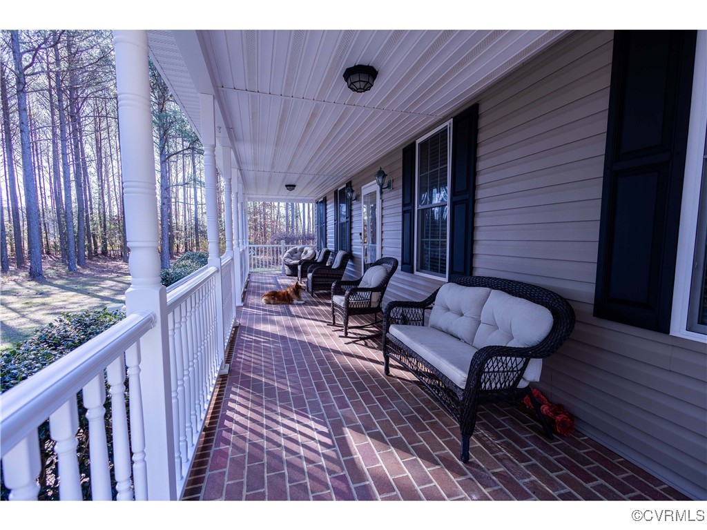 1047 Camera Road Waverly, VA 23890 - Photo 23 of 48 a sitting area with furniture on wooden floor