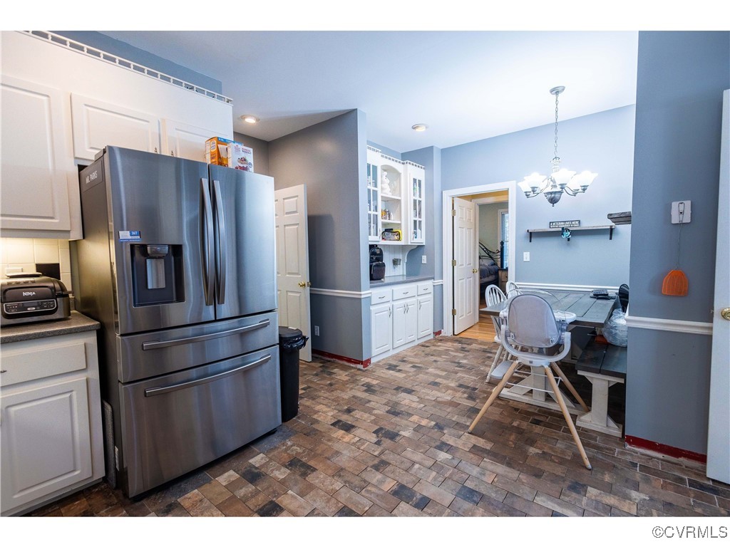 1047 Camera Road Waverly, VA 23890 - Photo 28 of 48 a kitchen with stainless steel appliances kitchen island granite countertop a refrigerator and a stove top oven