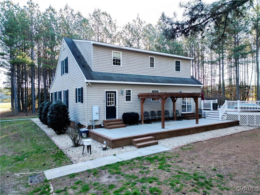 1047 Camera Road Waverly, VA 23890 - Photo 3 of 48 a front view of a house with garden