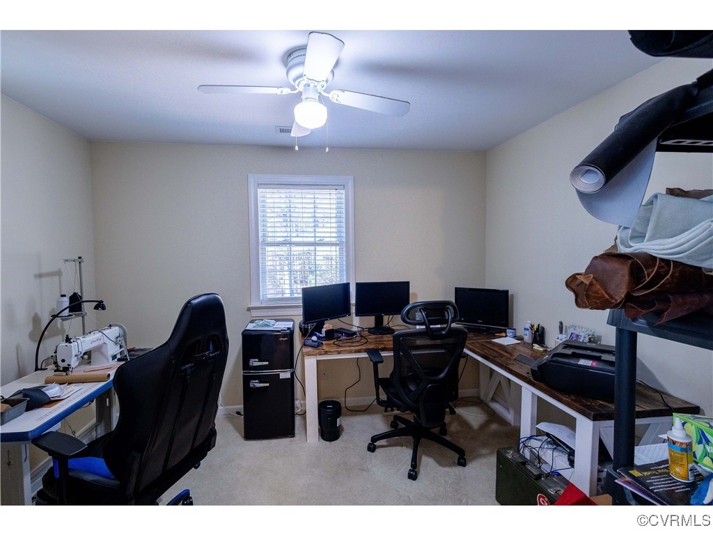 1047 Camera Road Waverly, VA 23890 - Photo 34 of 48 a view of a workspace with furniture and a window