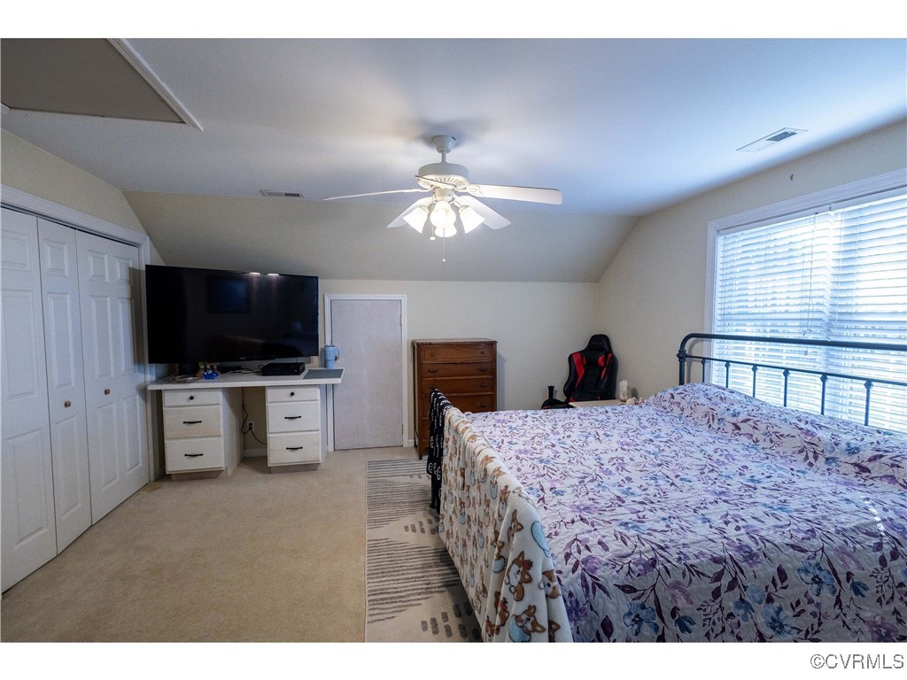 1047 Camera Road Waverly, VA 23890 - Photo 35 of 48 a living room with furniture and a flat screen tv