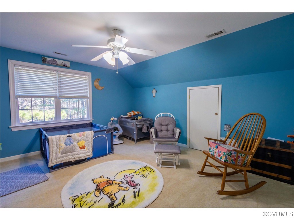1047 Camera Road Waverly, VA 23890 - Photo 36 of 48 a living room with furniture and a window
