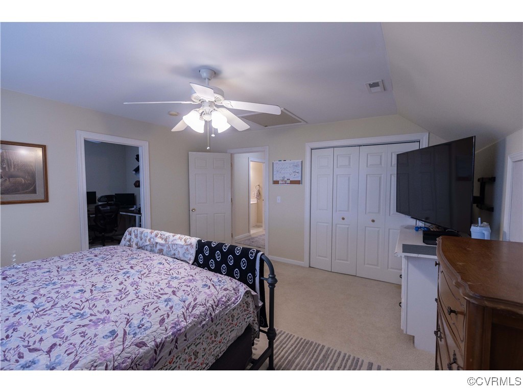 1047 Camera Road Waverly, VA 23890 - Photo 39 of 48 a bedroom with a bed and a flat screen tv