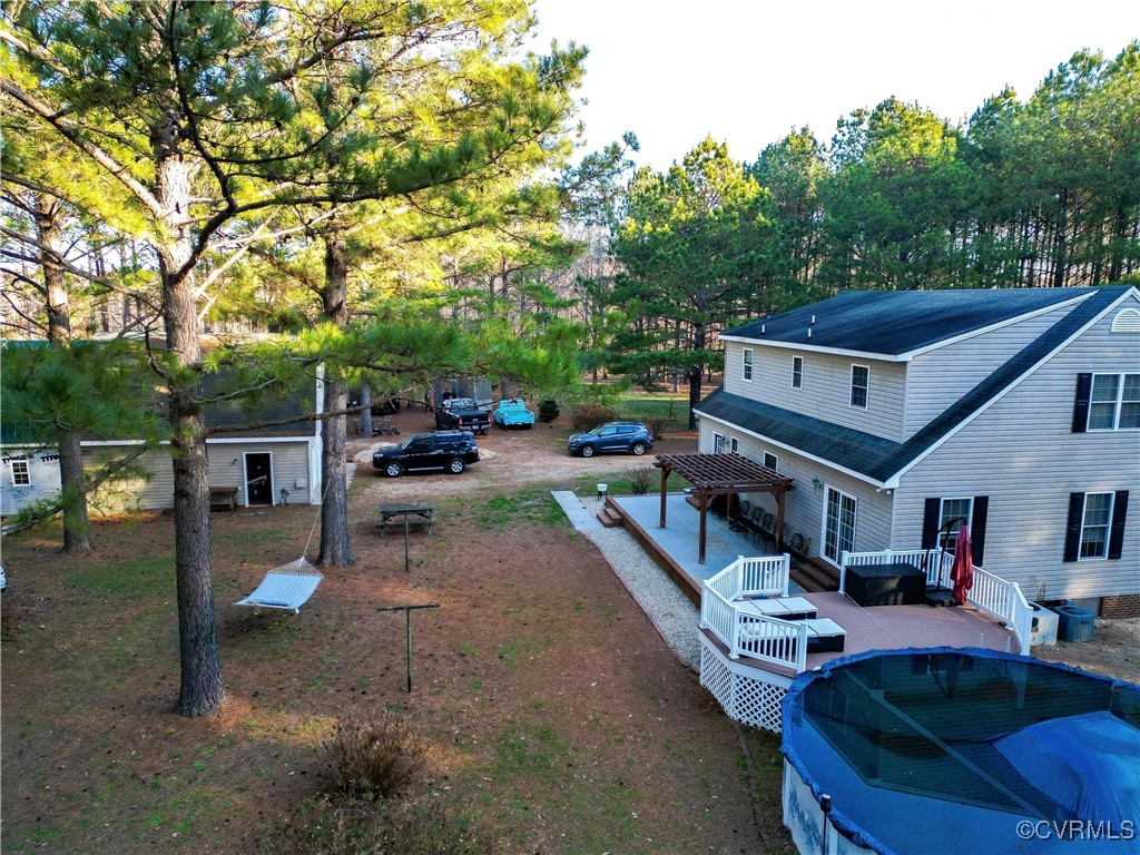 1047 Camera Road Waverly, VA 23890 - Photo 47 of 48 a house view with a sitting space fire pit and outdoor space