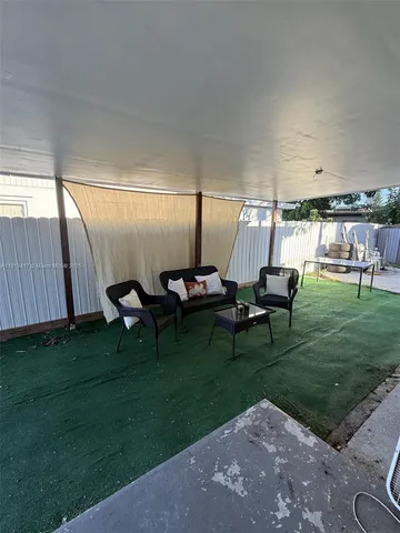 a view of a bench in backyard of building