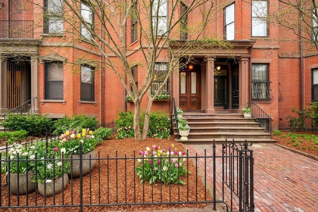 381 Beacon Street Boston, MA 02116 - Photo 1 of 21 a view of a house with a small yard and plants