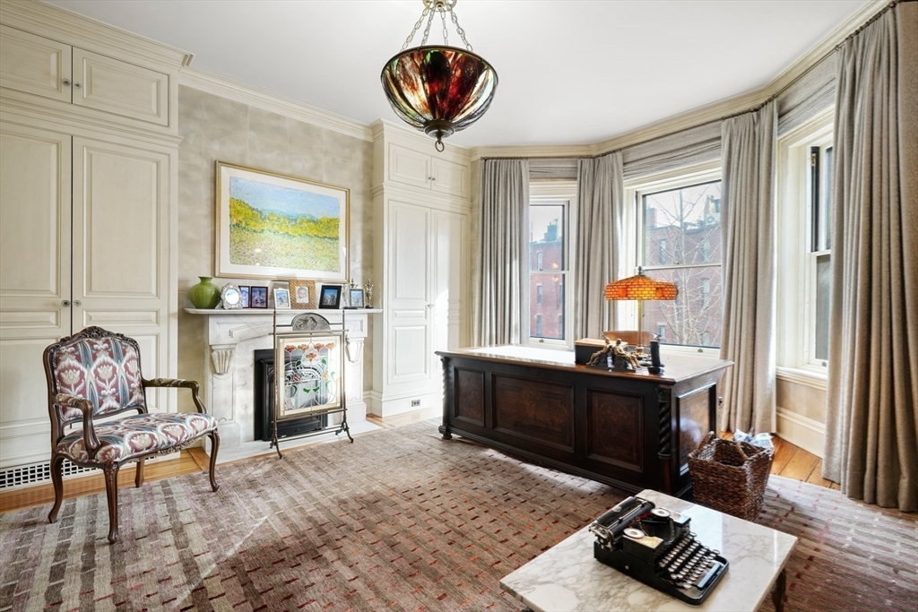 381 Beacon Street Boston, MA 02116 - Photo 12 of 21 a living room with furniture and a fireplace