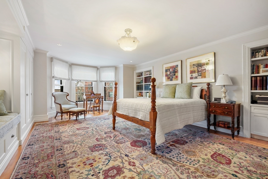 381 Beacon Street Boston, MA 02116 - Photo 13 of 21 a bed room with a bed and a chair