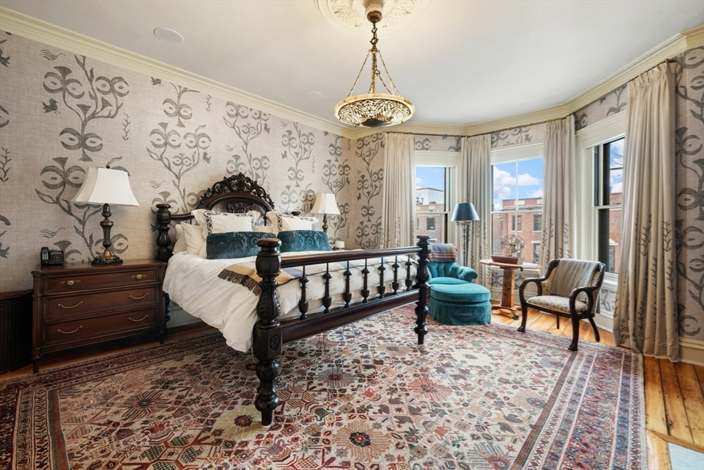 381 Beacon Street Boston, MA 02116 - Photo 10 of 21 a bed room with furniture and a window