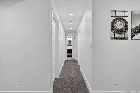 a bathroom with a toilet a sink and glass door