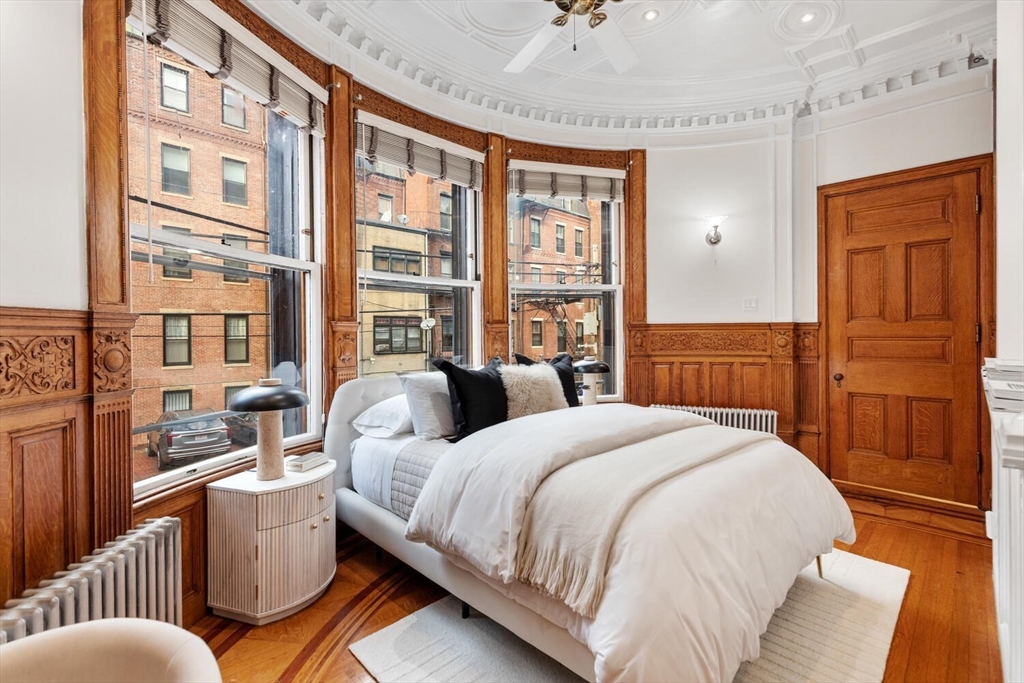 261 Marlborough Street, Unit 4R Boston, MA 02116 - Photo 12 of 36 a bedroom with a bed and a dresser