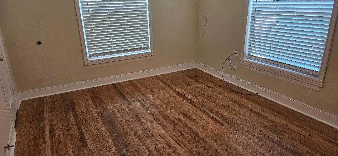 932 Walling Street Houston, TX 77009 - Photo 12 of 14 a view of a room with wooden floor and a window