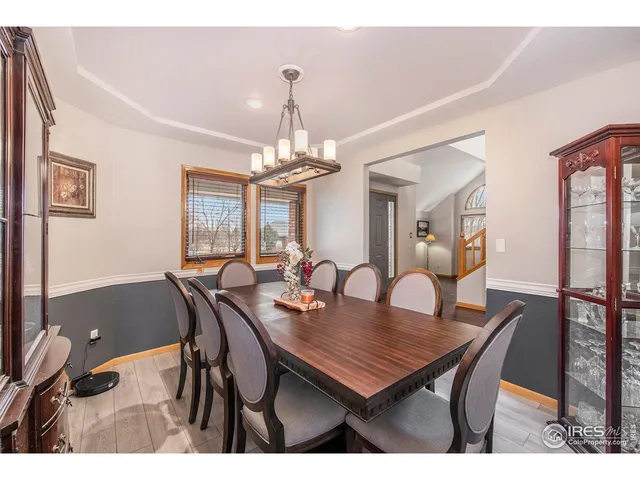 a view of a dining room with furniture and window