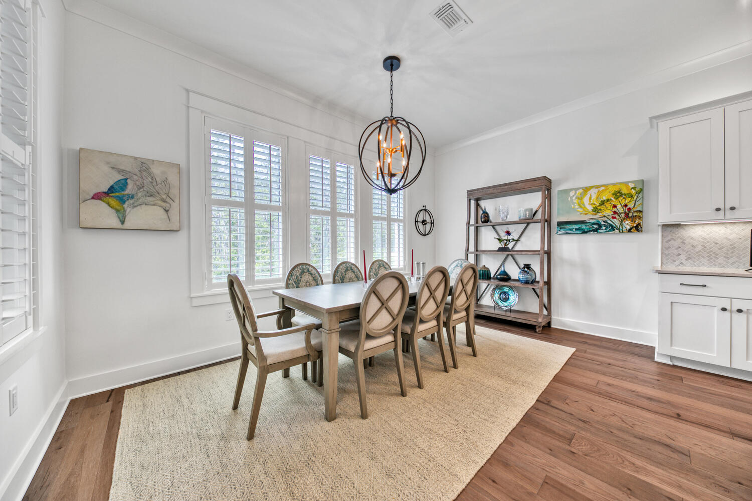 235 Ridgewalk Circle Santa Rosa Beach, FL 32459 - Photo 17 of 44 a view of a dining room with furniture a chandelier and wooden floor