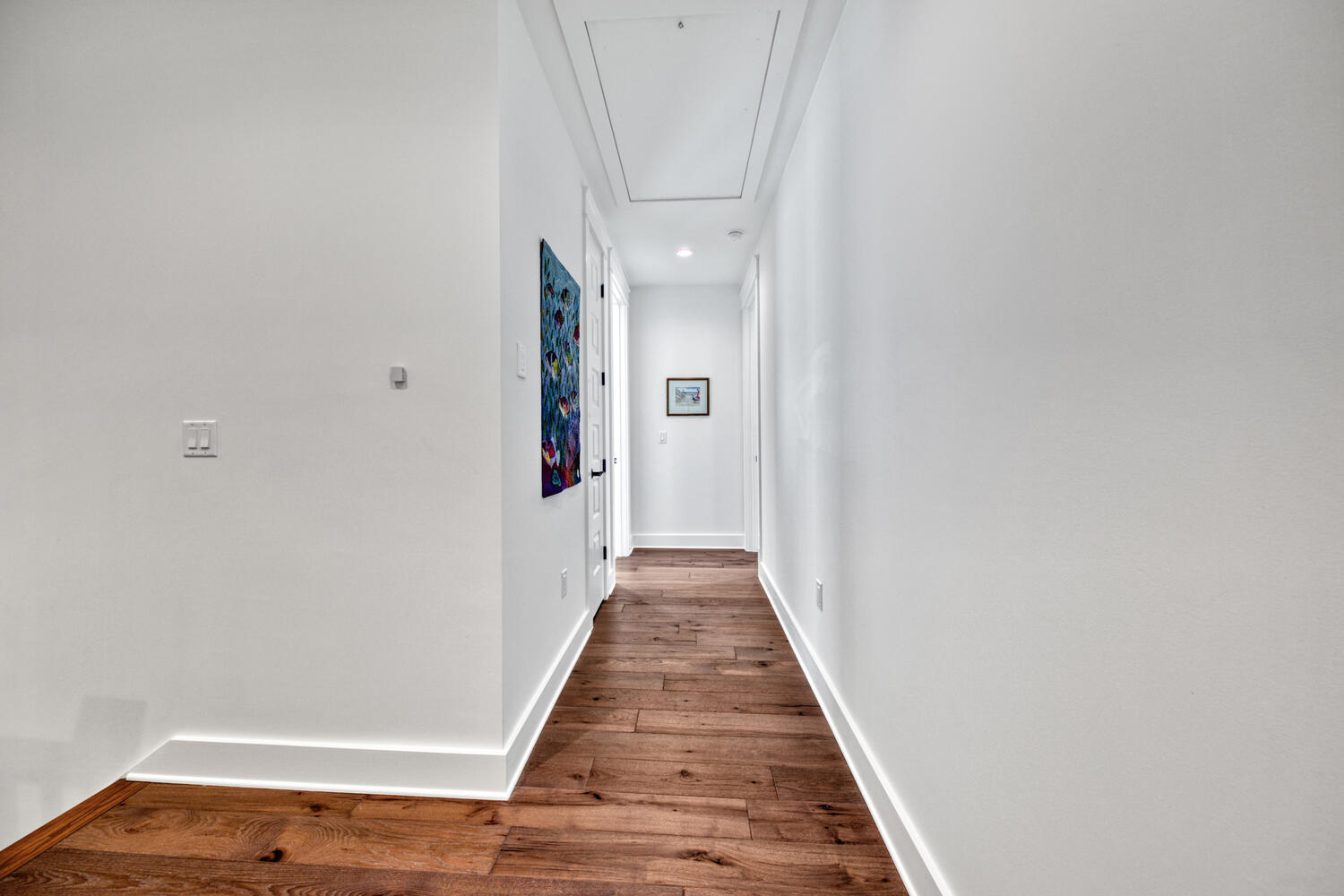 235 Ridgewalk Circle Santa Rosa Beach, FL 32459 - Photo 32 of 44 a view of a hallway with wooden floor