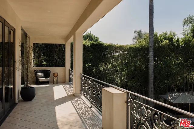 a view of balcony with furniture