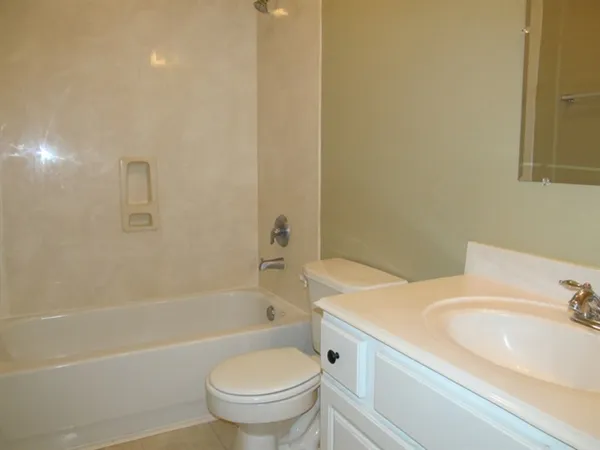 a bathroom with a sink toilet and a bathtub