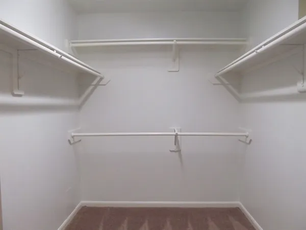 a view of an empty walk in closet