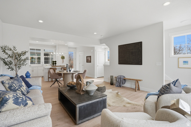 7338 South Seven Tree Lane, Unit 75 Midvale, UT 84047 - Photo 10 of 30 Living room featuring light wood finished floors and suspended lighting